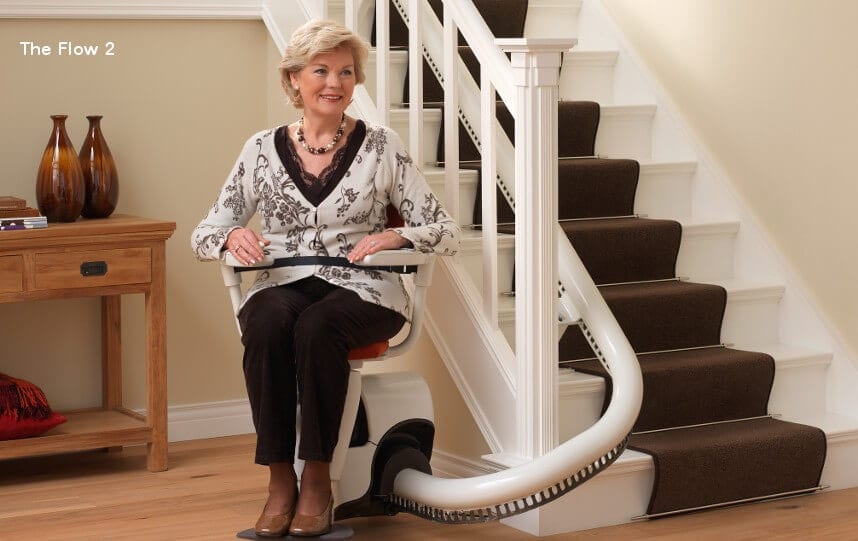 Woman Sitting On Stairlift